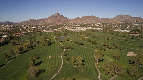 An aerial view of a golf course in Scottsdale, Arizona, offered by a Paradise Valley Real Estate Agent.